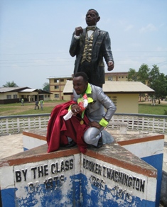 One of the graduates under the monument Booker T. Washington Himself