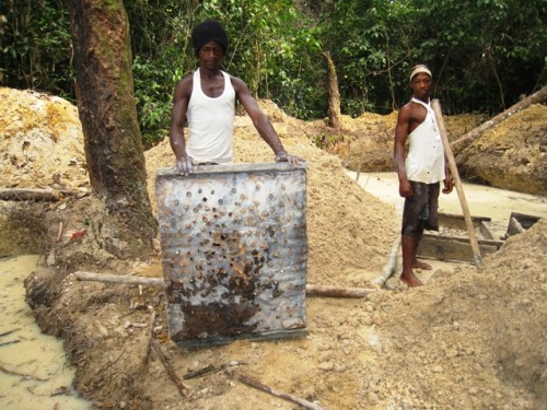 Diamond digger displaying a tool Liberia
