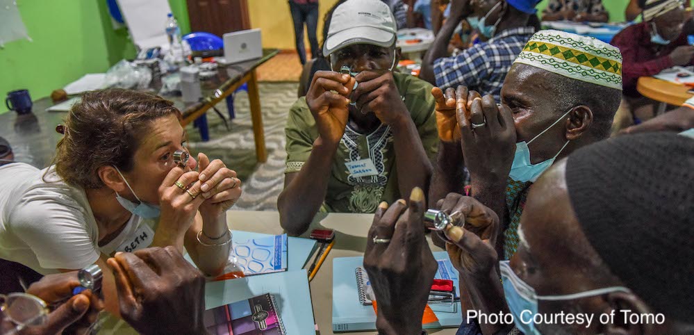 Workshop participants practice how to use 10x loupe